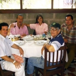 In Havana, with Spanish journalist (TVE) José Manuel Martín Medem. Seated at right, Cuban writers Angel Santiesteban (background) and Luis Adrián Betancourt. Havana, Cuba, 2004.